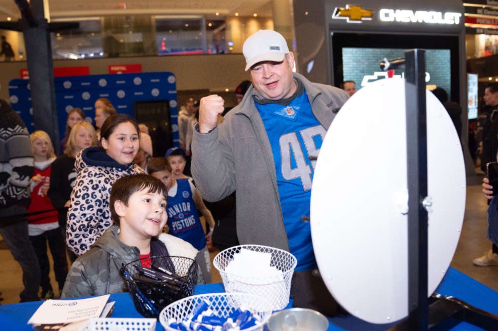 man excited from spin wheel, little boy smiling